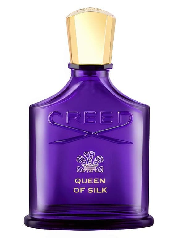 Creed Queen of Silk perfume bottle – blurred decorative background