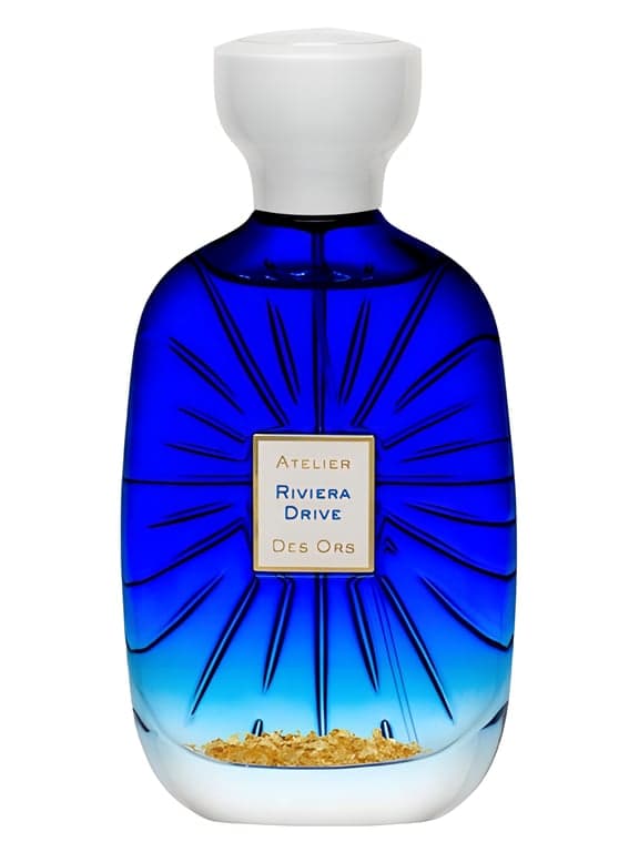 Atelier des Ors Pomelo Riviera perfume bottle – blurred decorative background