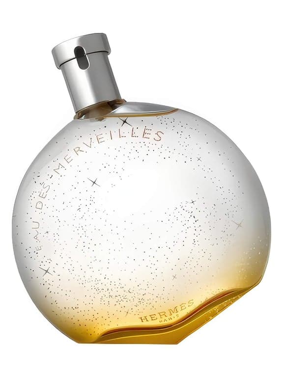 Hermès Eau des Merveilles perfume bottle – blurred decorative background