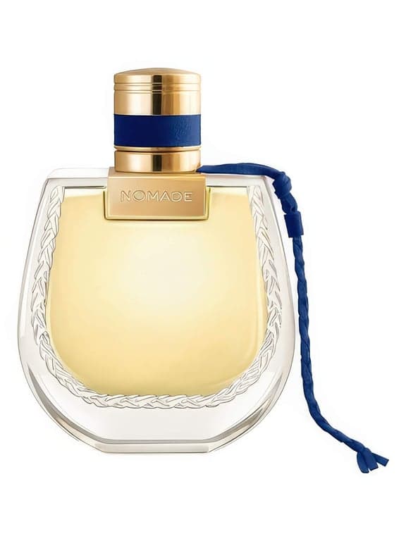 Chloé Nomade Nuit d’Egypte perfume bottle – blurred decorative background