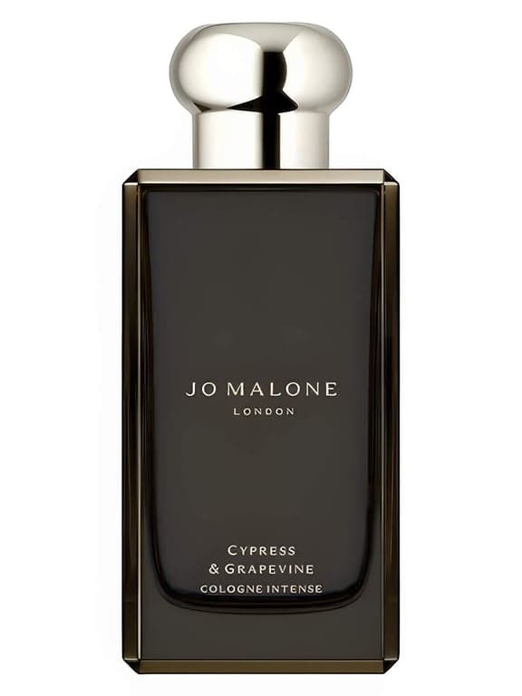 Jo Malone London Cypress & Grapevine Cologne Intense perfume bottle – blurred decorative background